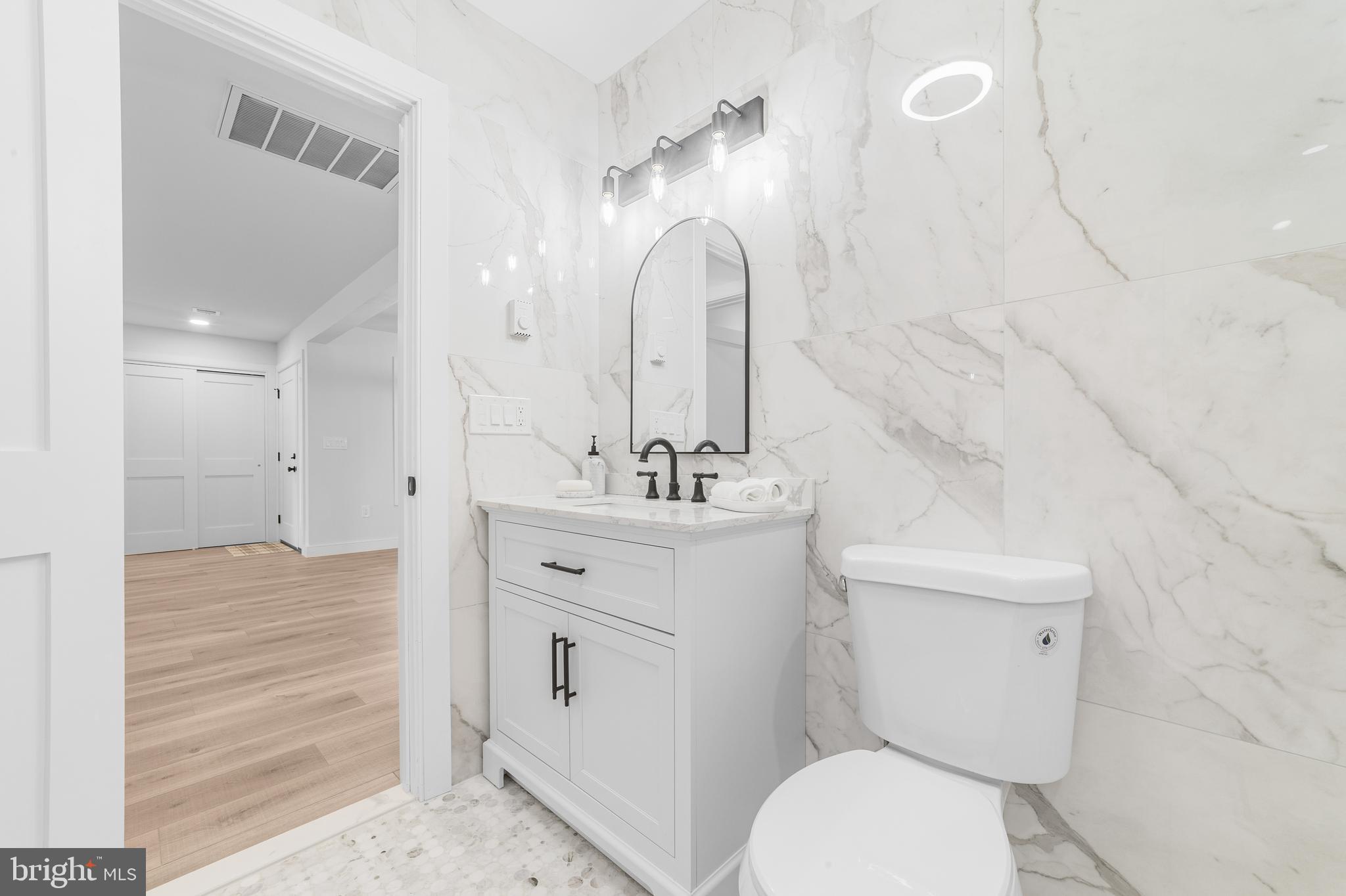 737A Prospect Road Monroe Township, NJ 08831 - Photo 22 of 28 a bathroom with a sink a toilet and shower