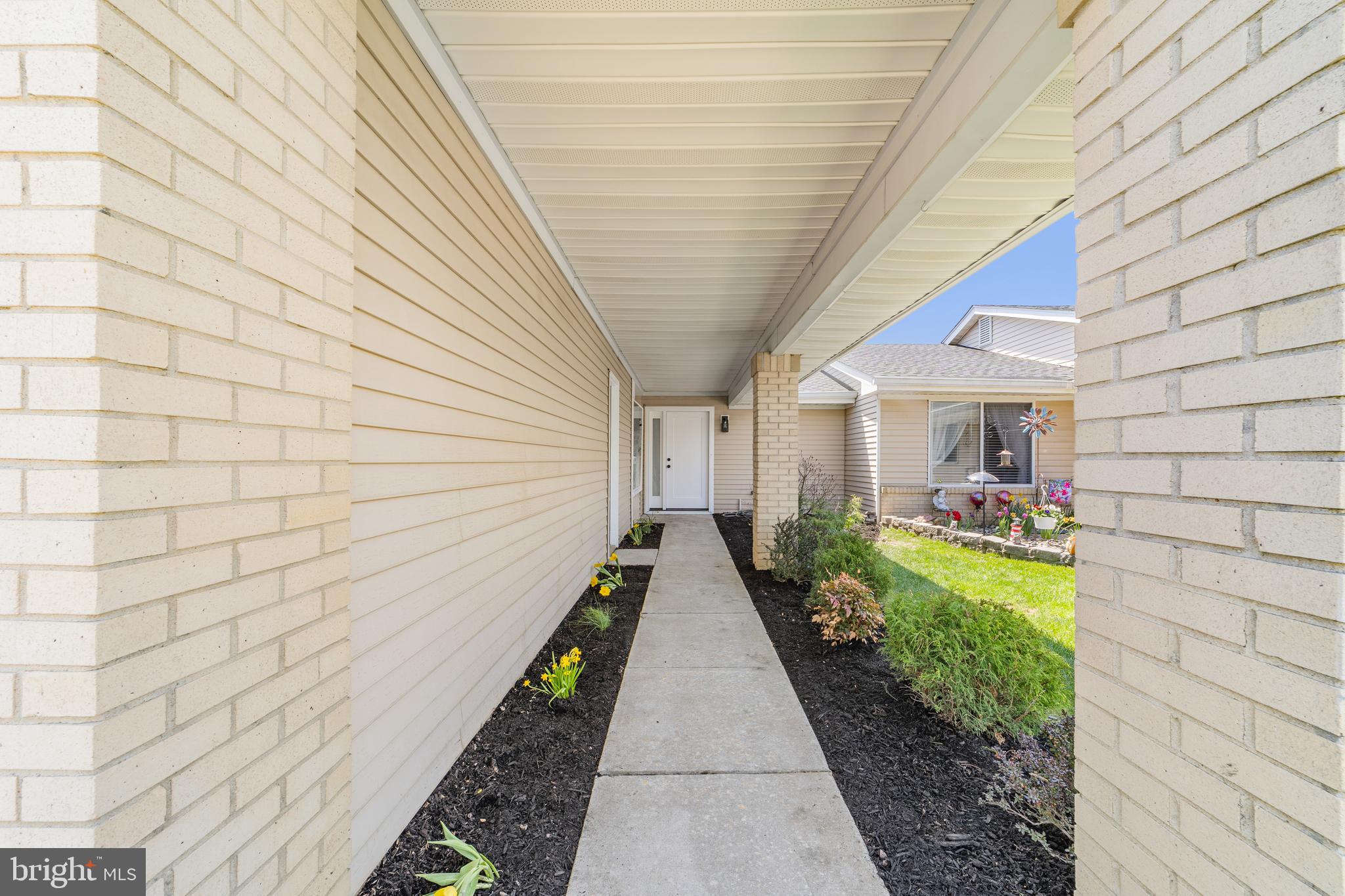 737A Prospect Road Monroe Township, NJ 08831 - Photo 3 of 28 a view of a pathway with a house in the backyard