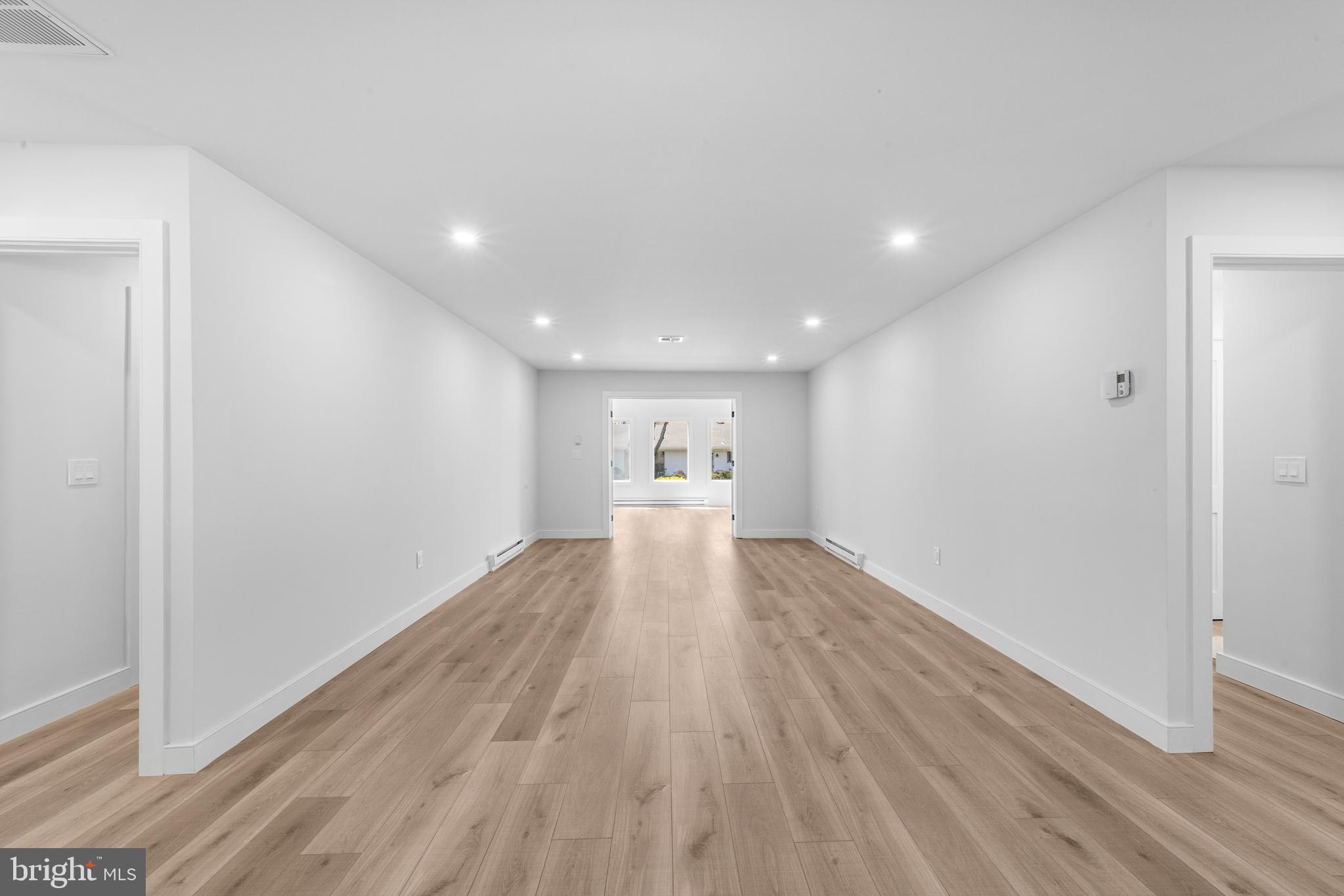 737A Prospect Road Monroe Township, NJ 08831 - Photo 4 of 28 a view of a big room with wooden floor and windows