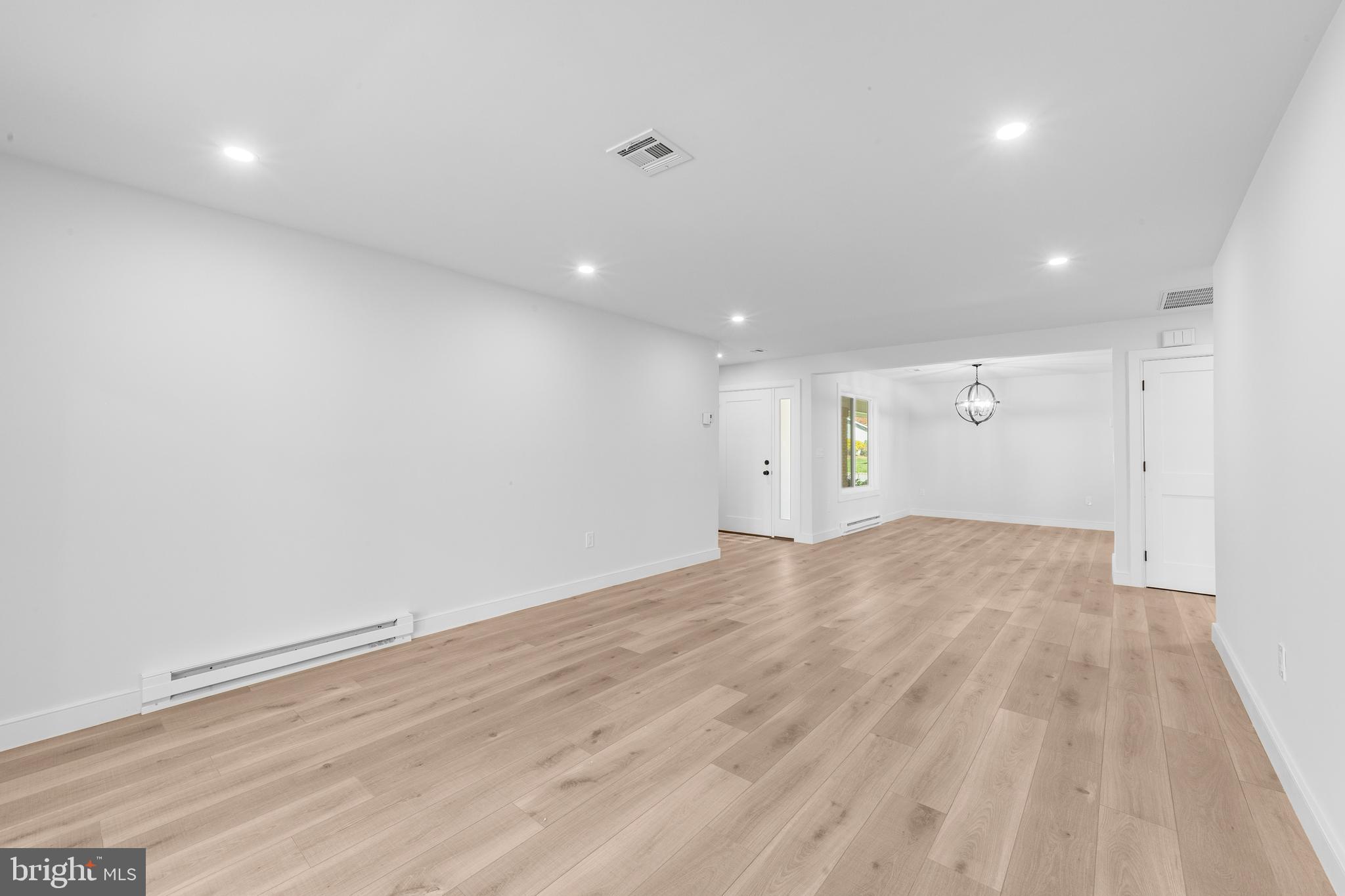 737A Prospect Road Monroe Township, NJ 08831 - Photo 5 of 28 an empty room with wooden floor and windows