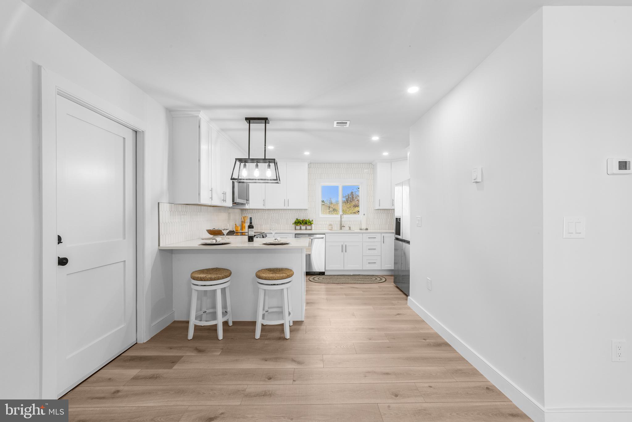 737A Prospect Road Monroe Township, NJ 08831 - Photo 10 of 28 a kitchen with a sink cabinets and wooden floor