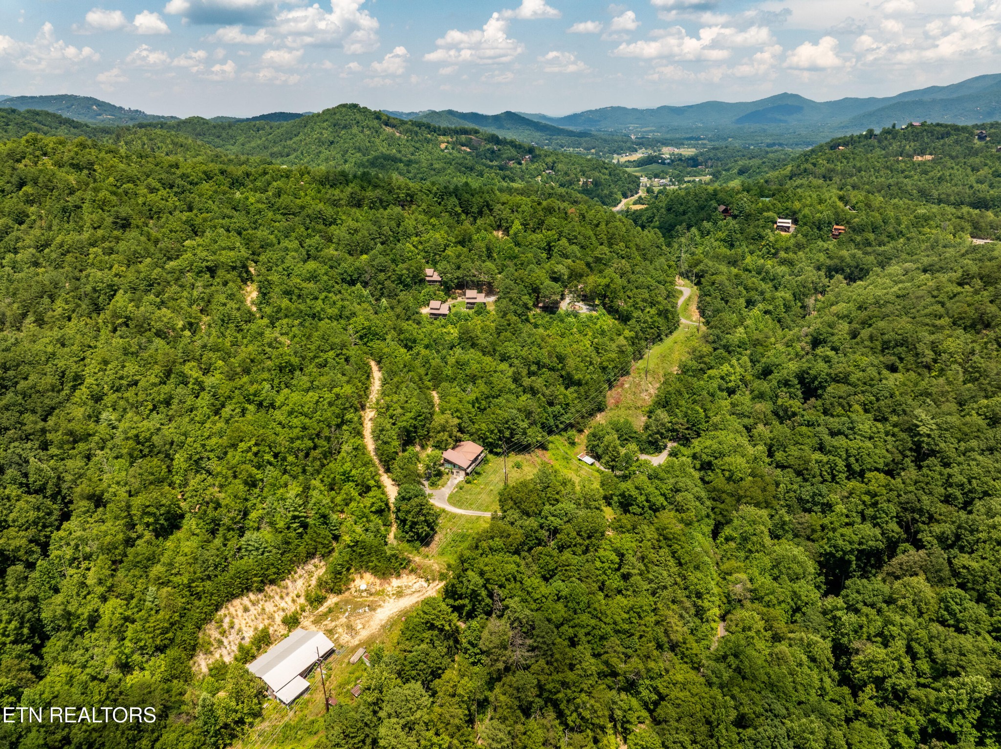 0 Lot 3r Wears Valley Road Townsend, TN 37882 - Photo 32 of 38 a view of a lush green forest with houses in the back