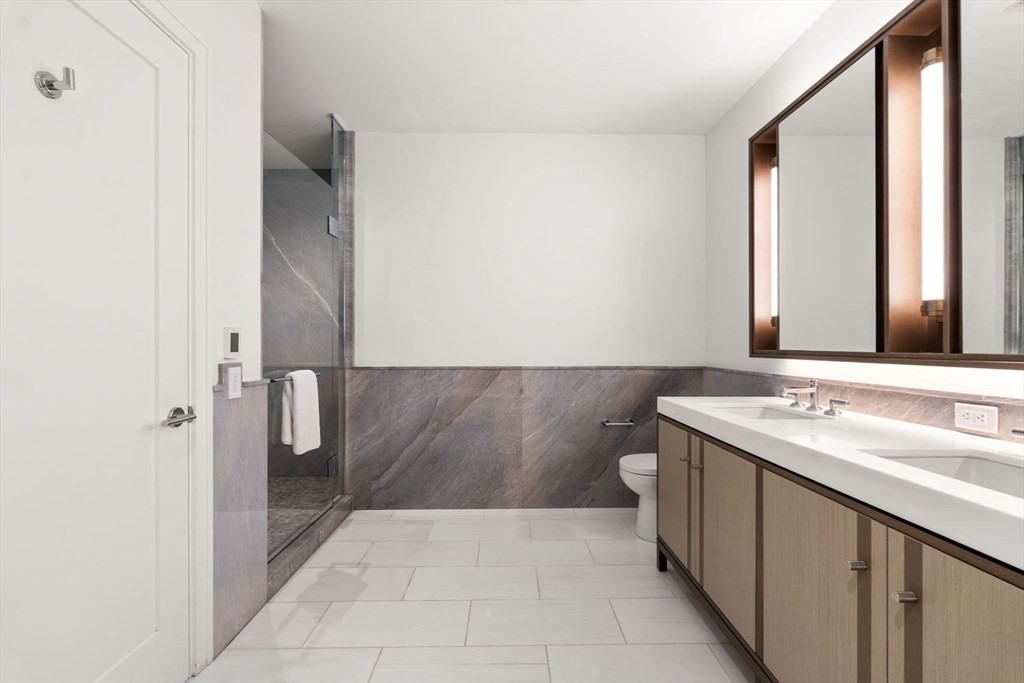 380 Harrison Avenue, Unit 14G Boston, MA 02118 - Photo 13 of 40 a bathroom with a sink and a mirror