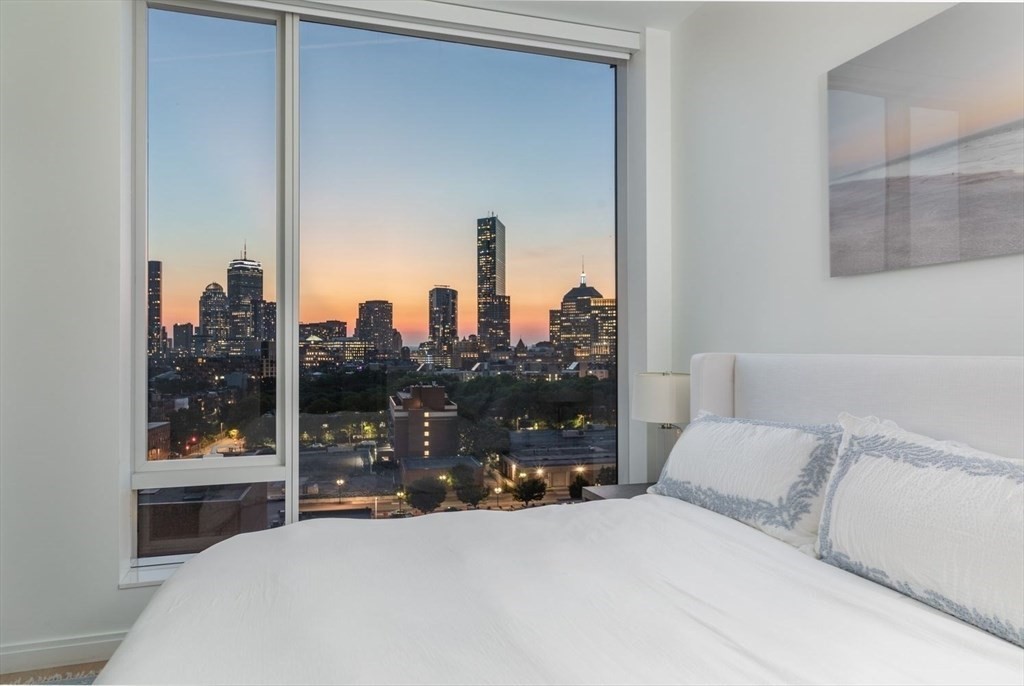 380 Harrison Avenue, Unit 14G Boston, MA 02118 - Photo 21 of 40 a bedroom with a large window and a bed