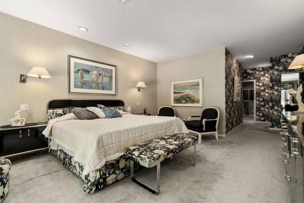 228 Allandale Road, Unit 1B Boston, MA 02467 - Photo 13 of 30 a spacious bedroom with a bed and a table in it