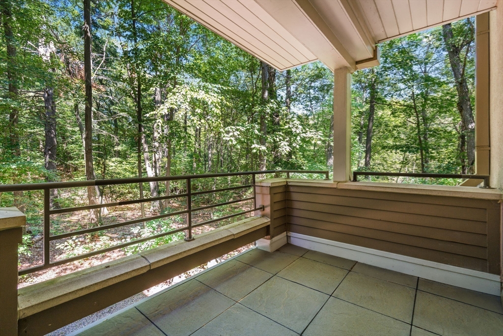 228 Allandale Road, Unit 1B Boston, MA 02467 - Photo 25 of 30 a view of a bench in the balcony