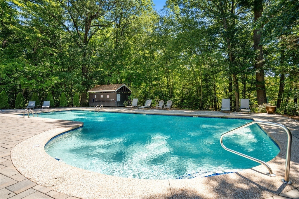 228 Allandale Road, Unit 1B Boston, MA 02467 - Photo 26 of 30 a view of a swimming pool with a yard