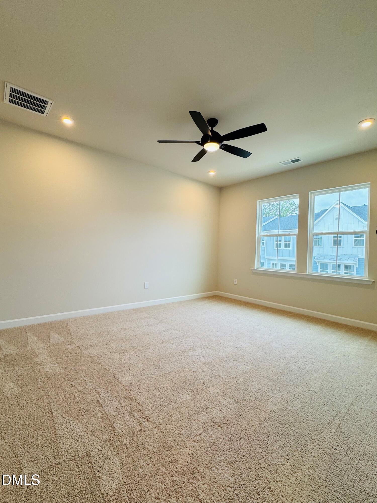 706 Hyperion Alley Wake Forest, NC 27587 - Photo 15 of 65 a view of an empty room with a window