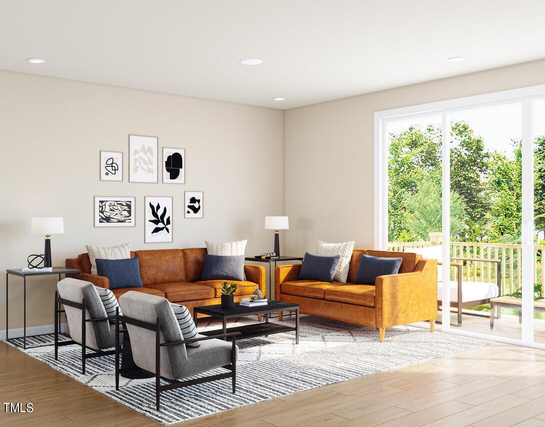 706 Hyperion Alley Wake Forest, NC 27587 - Photo 24 of 67 a living room with furniture and a large window