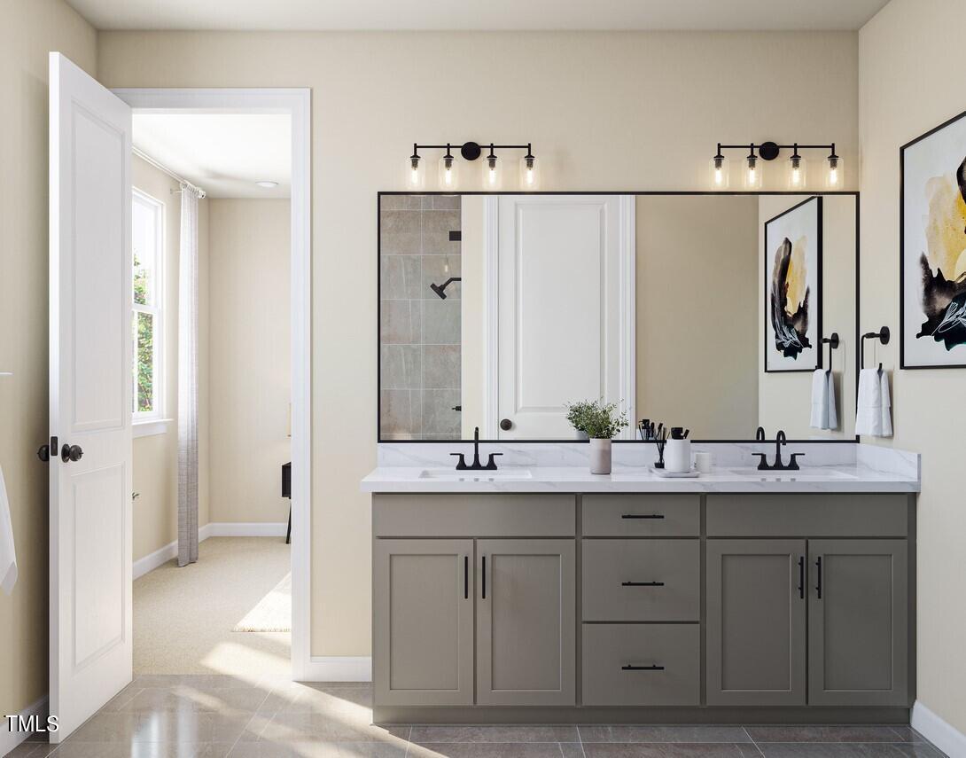 706 Hyperion Alley Wake Forest, NC 27587 - Photo 27 of 65 a bathroom with a double vanity sink mirror and double