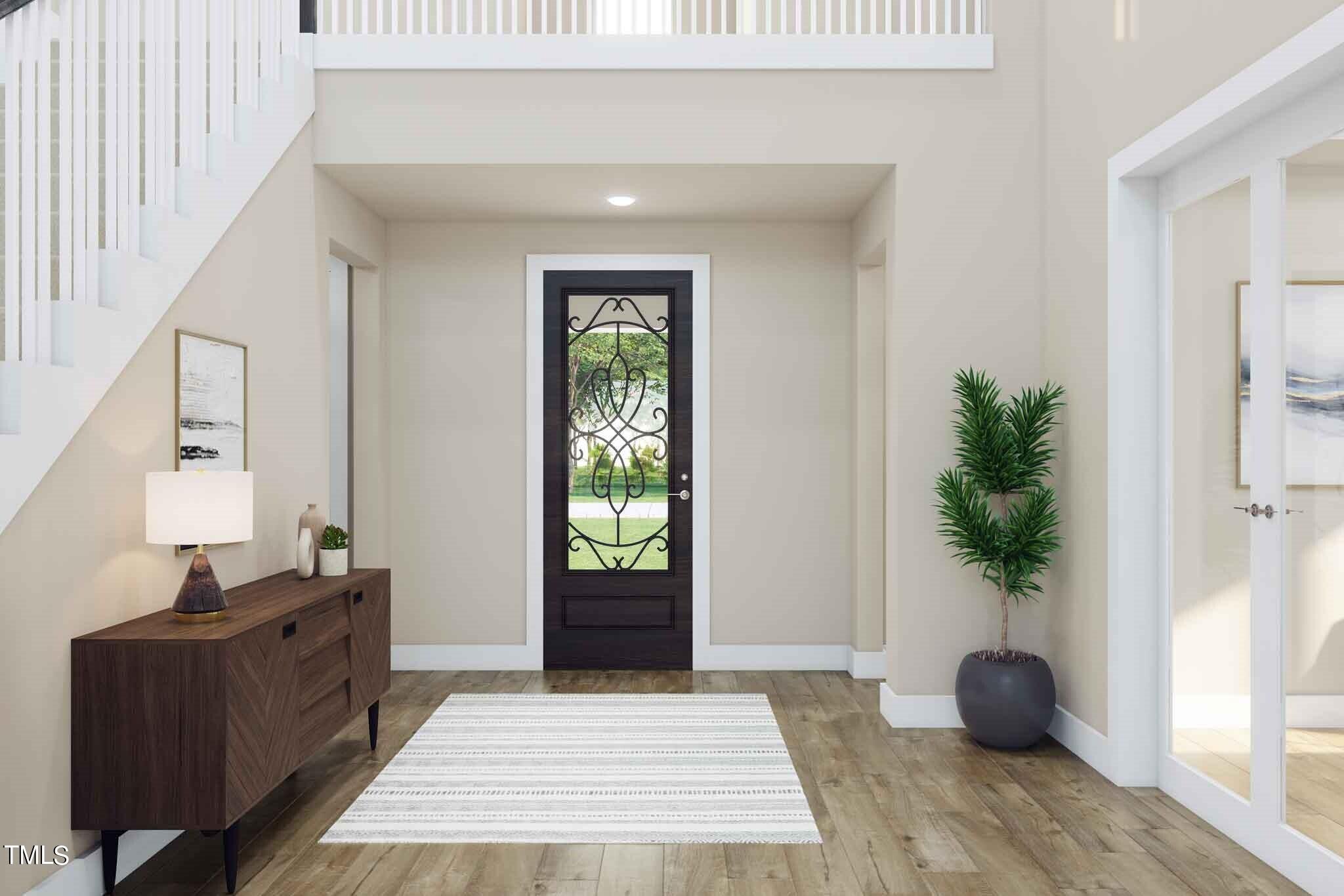 706 Hyperion Alley Wake Forest, NC 27587 - Photo 27 of 67 a living room with furniture and a potted plant