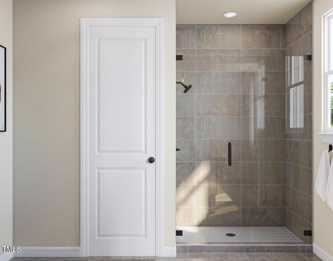 706 Hyperion Alley Wake Forest, NC 27587 - Photo 28 of 65 a bathroom with a shower