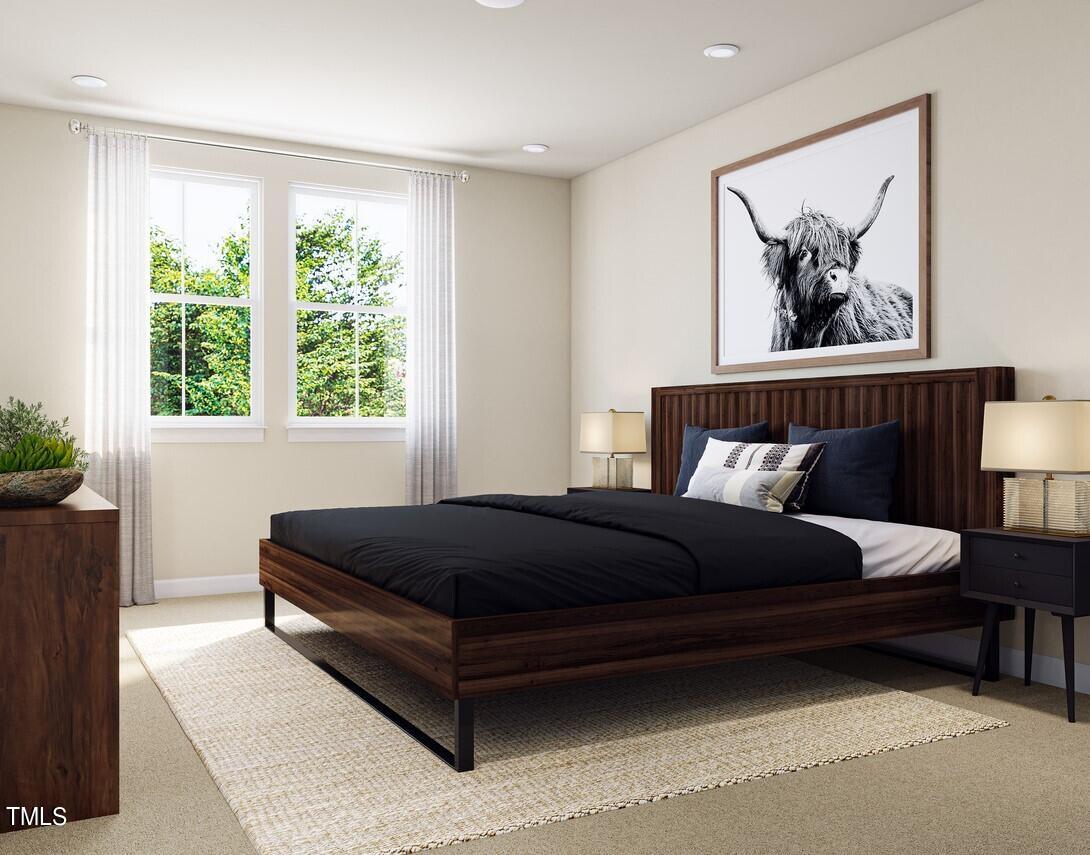 706 Hyperion Alley Wake Forest, NC 27587 - Photo 28 of 67 a bed sitting in a bedroom next to a window