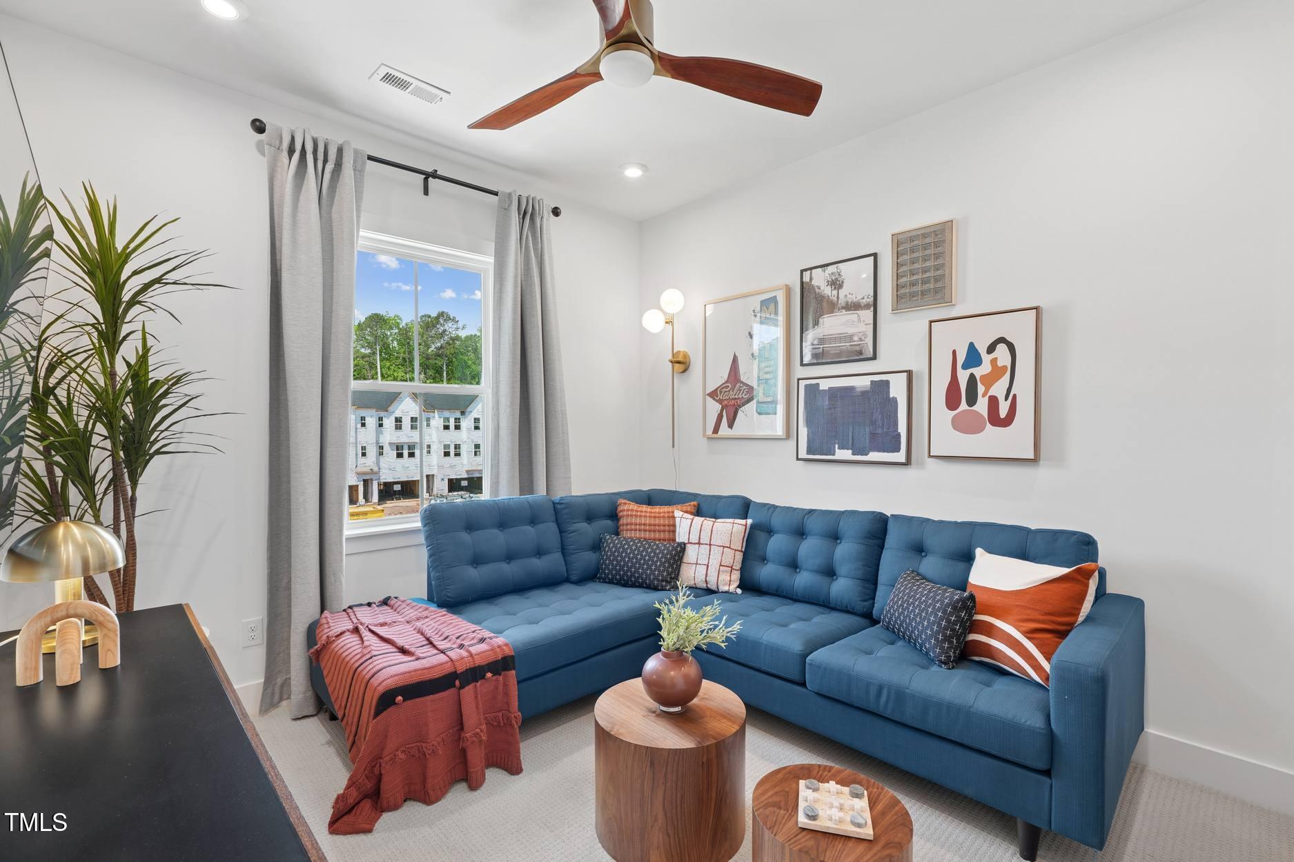 706 Hyperion Alley Wake Forest, NC 27587 - Photo 51 of 65 a living room with furniture and a large window