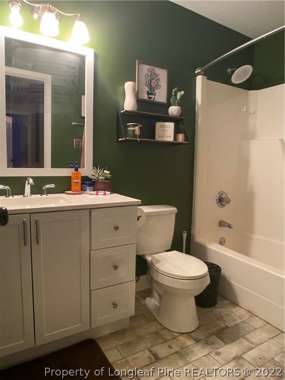 537 Andover Road Fayetteville, NC 28311 - Photo 2 of 4 a bathroom with a toilet sink and shower