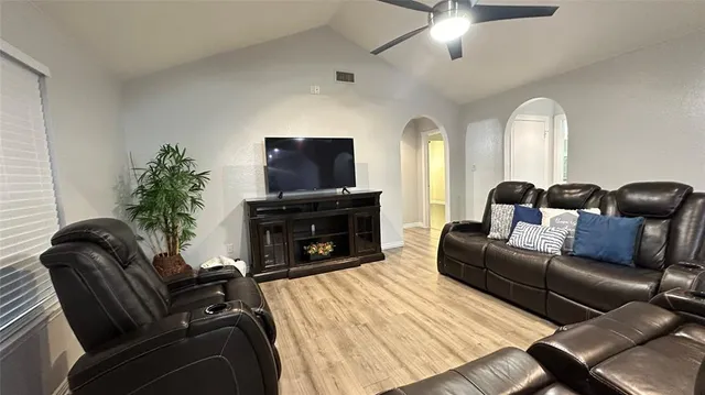 a view of a livingroom with furniture and a flat screen tv