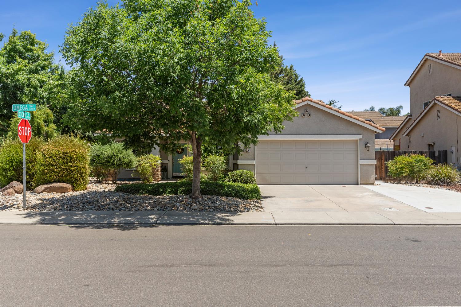 2912 Omega Way Modesto, CA 95355 - Photo 1 of 1 a front view of a house with a yard and garage