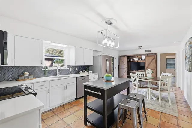 a view of a kitchen area with furniture and window