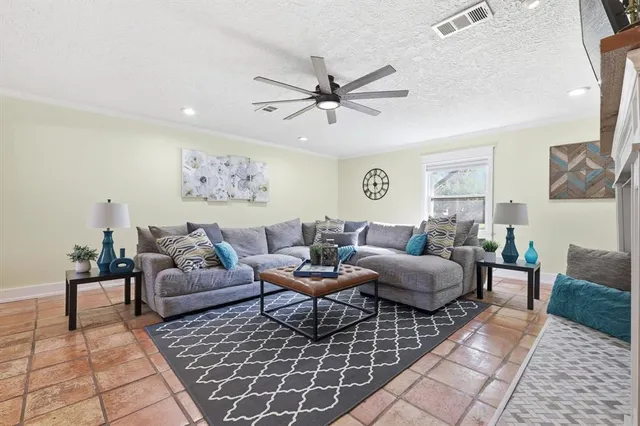 a living room with furniture and a rug
