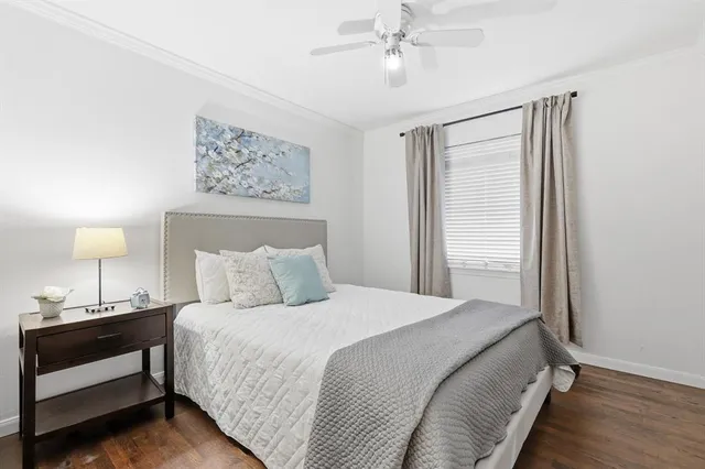 a bedroom with bed and window