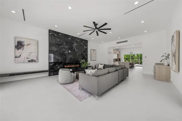 a spacious bedroom with a large bed and a window