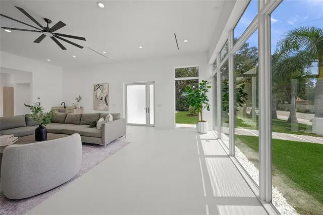 a bedroom with a bed and a potted plant
