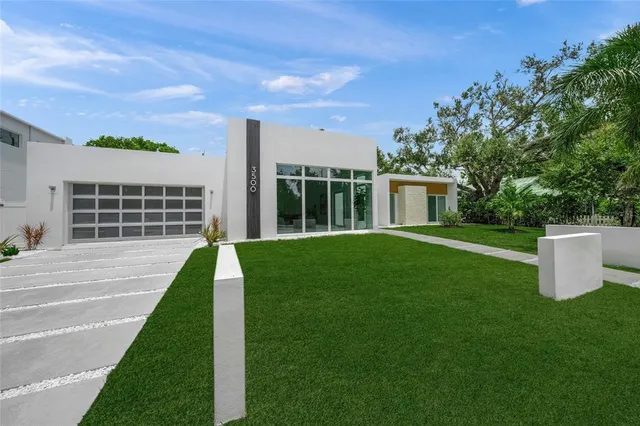 front view of a house with a yard