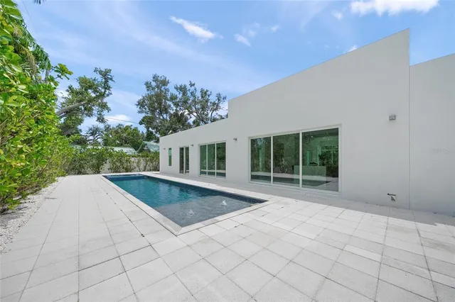 a spacious bedroom with a bed and a window