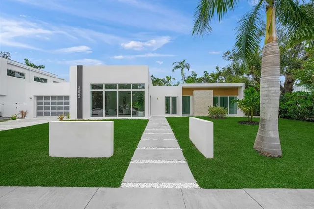 a view of a yard with an ocean view