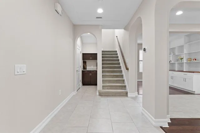 a view of entryway and hall with a rug