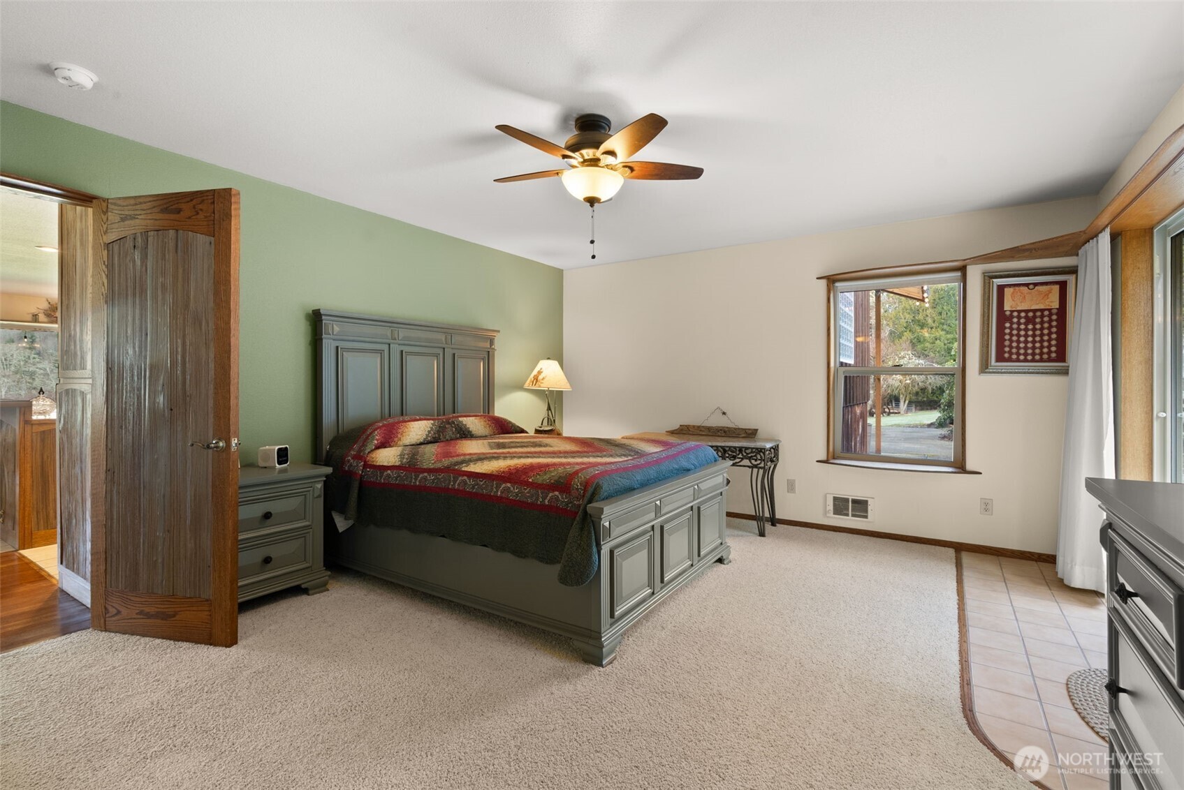 65 Wilderness Road Oakville, WA 98568 - Photo 11 of 40 a spacious bedroom with a bed and a window