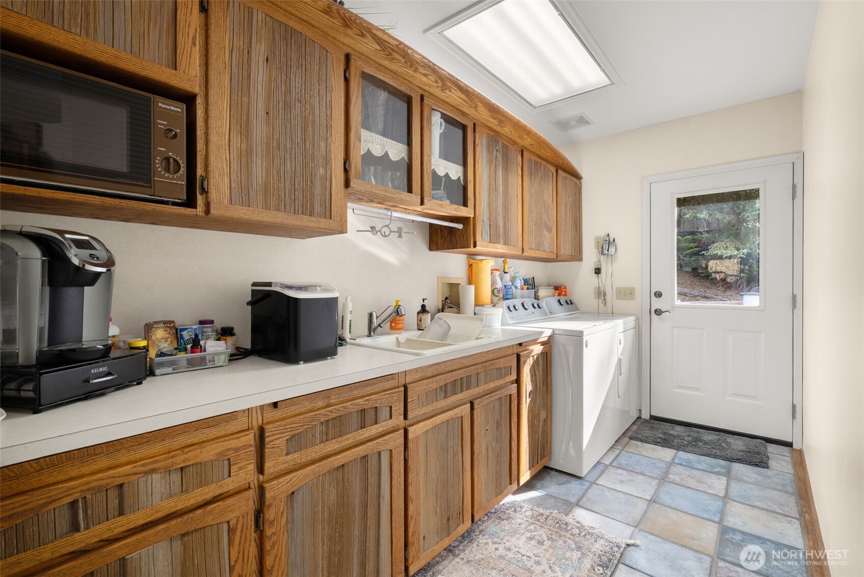 65 Wilderness Road Oakville, WA 98568 - Photo 18 of 40 a kitchen with stainless steel appliances granite countertop a sink stove and cabinets