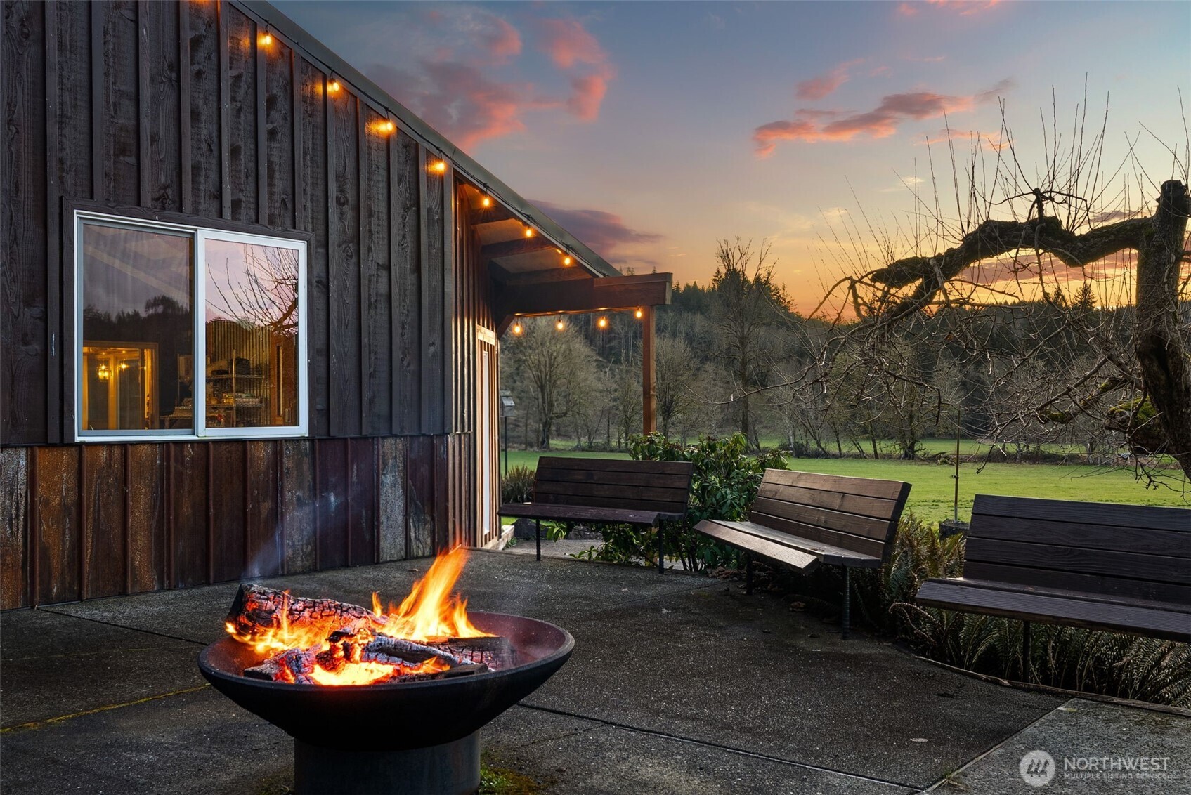 65 Wilderness Road Oakville, WA 98568 - Photo 22 of 40 a backyard of a house with fire pit and outdoor seating