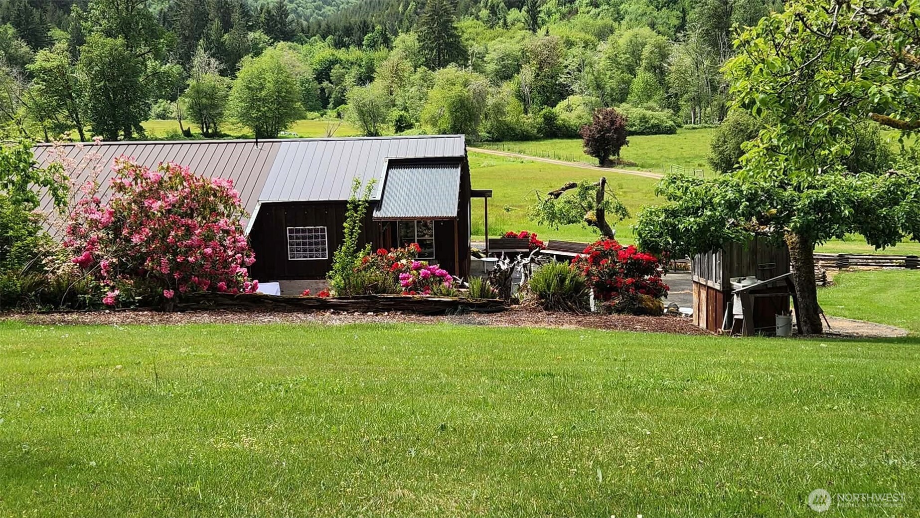 65 Wilderness Road Oakville, WA 98568 - Photo 24 of 40 a view of a house with a back yard