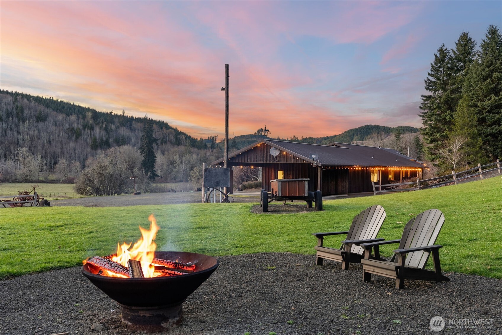 65 Wilderness Road Oakville, WA 98568 - Photo 27 of 40 a view of a table and chairs in backyard of the house