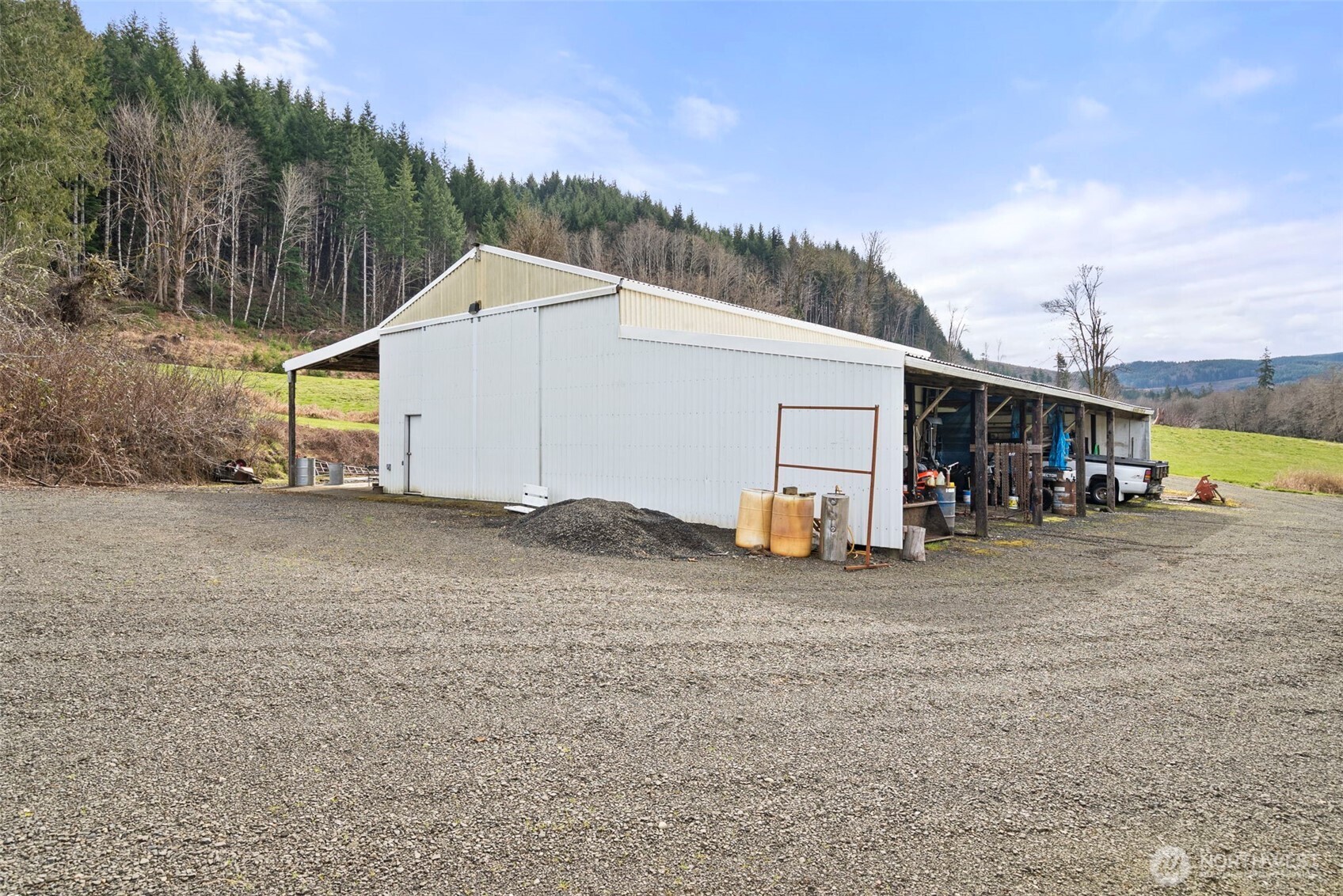 65 Wilderness Road Oakville, WA 98568 - Photo 30 of 40 a view of a house with a backyard