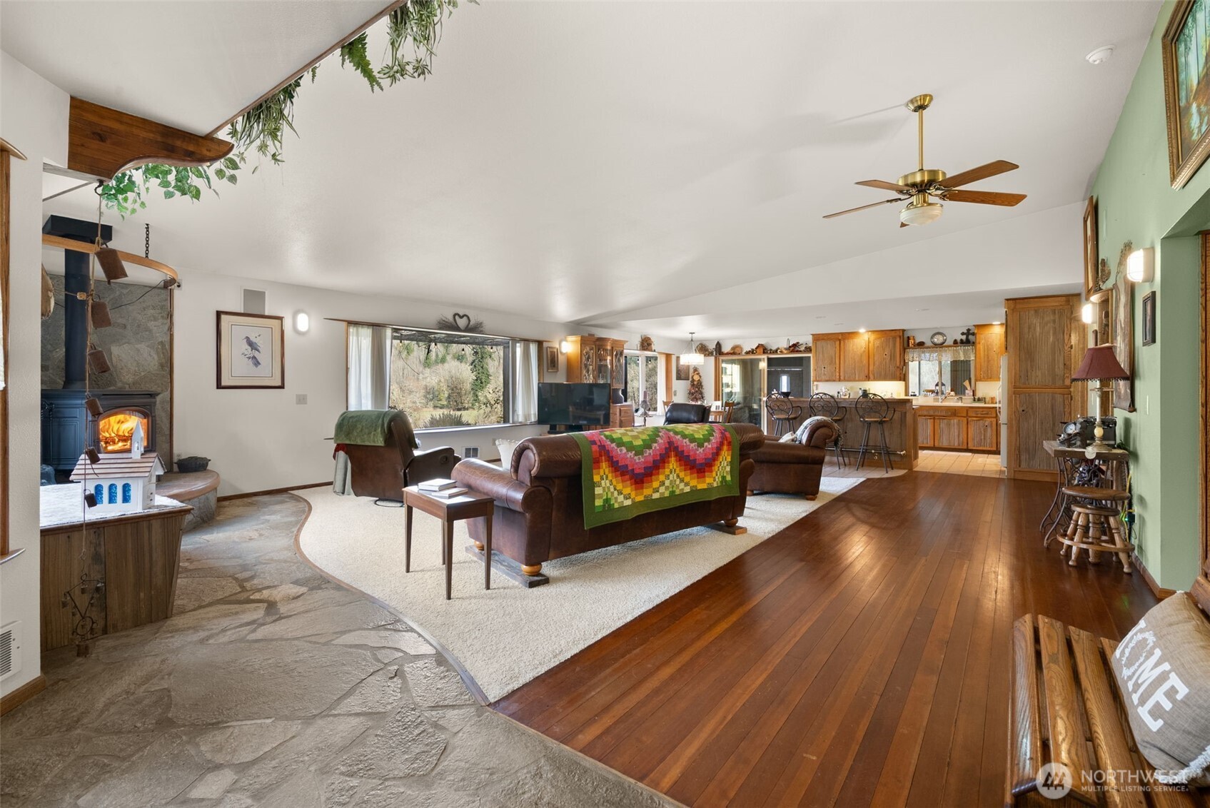 65 Wilderness Road Oakville, WA 98568 - Photo 6 of 40 a living room with furniture and a chandelier