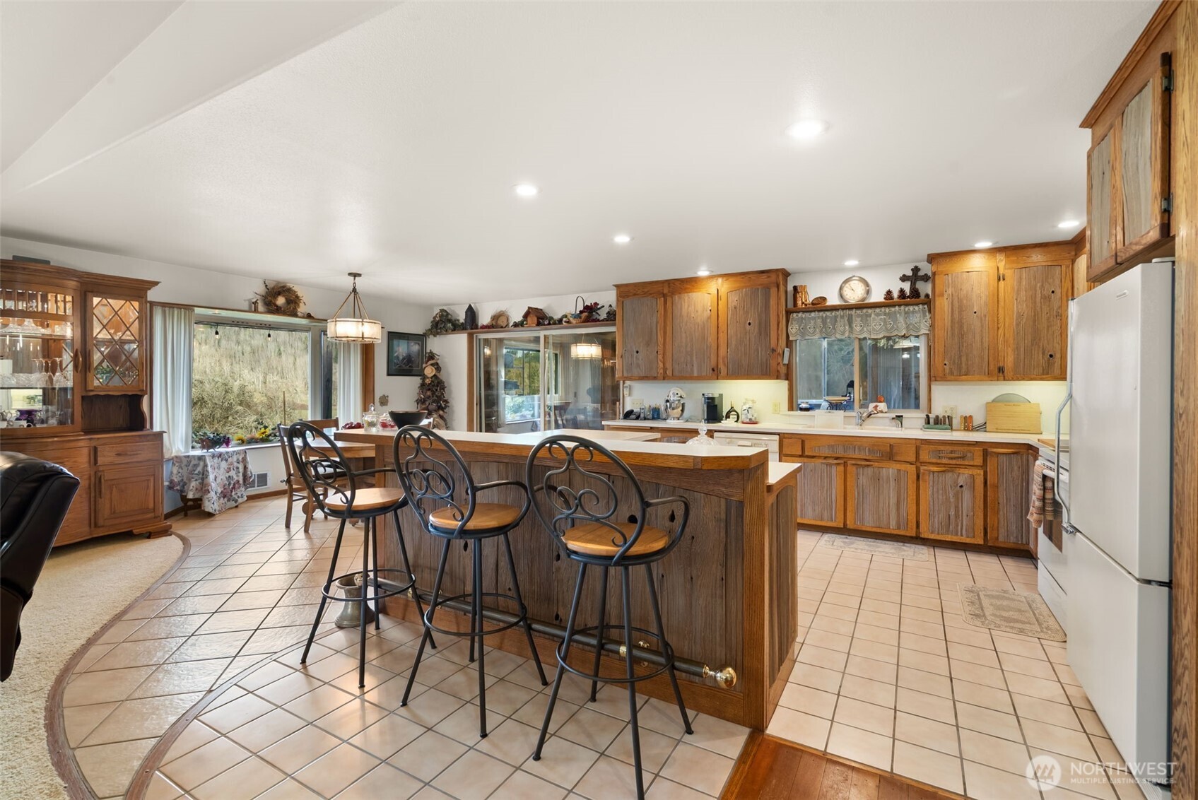 65 Wilderness Road Oakville, WA 98568 - Photo 8 of 40 a kitchen with stainless steel appliances kitchen island granite countertop a sink and cabinets
