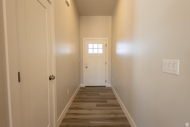 910 East Remington Road Cedar City, UT 84721 - Photo 18 of 29 Entryway featuring light wood-finish flooring, neutral wall paint, and a bright white door with multiple glass panes