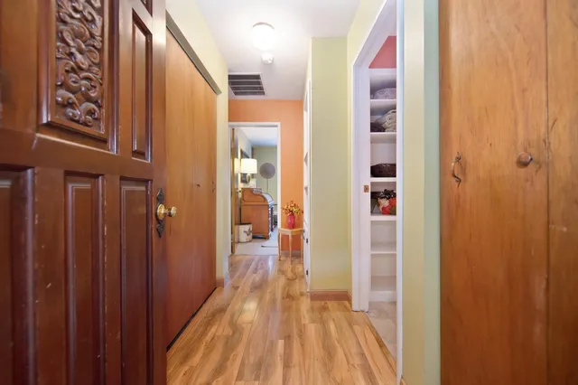 a view of an entryway with wooden floor