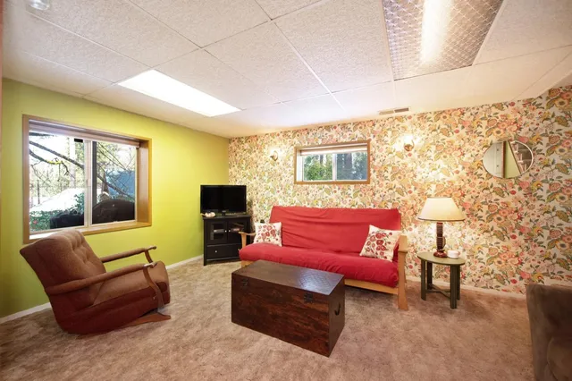 a view of a wooden house with a yard