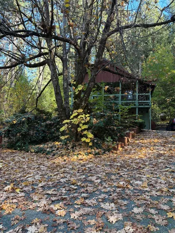 a kitchen with granite countertop white cabinets and stainless steel appliances