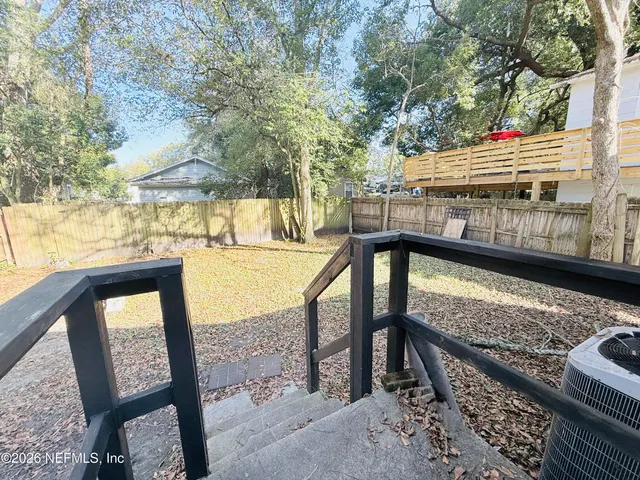 a view of a backyard with a patio