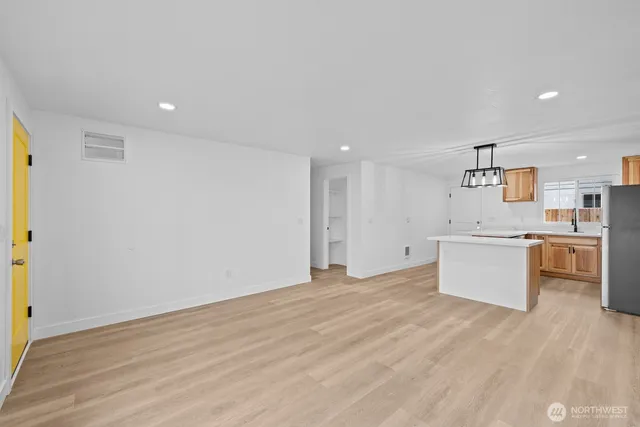 a view of a kitchen with stove top oven