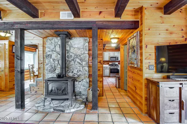 a view of a patio with a table chairs and wooden floor