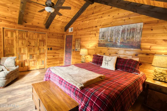 a view of a house with a yard and wooden fence