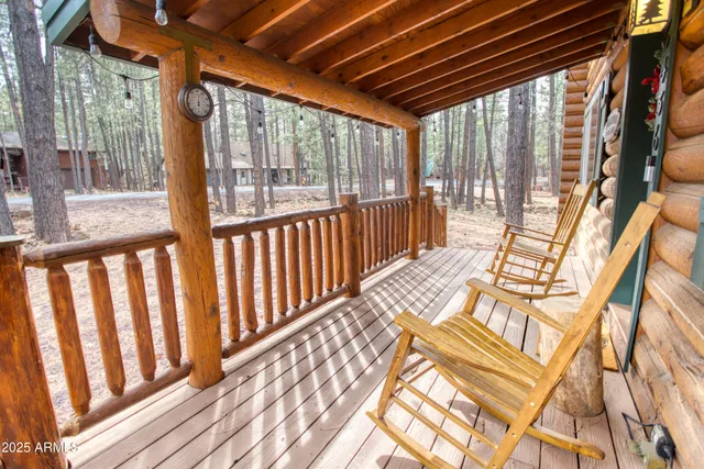 a living room with lots of furniture and a chandelier