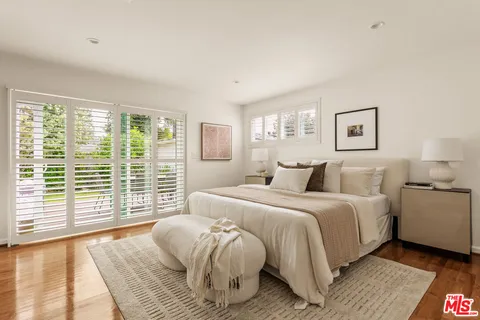 a bed room with a bed and a couch