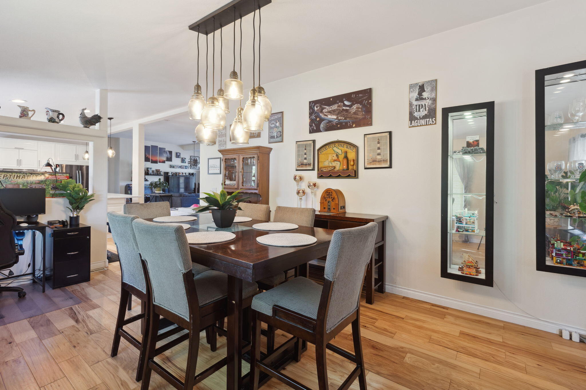3798 Leonard Road Grants Pass, OR 97527 - Photo 14 of 62 a view of a dining room with furniture and wooden floor
