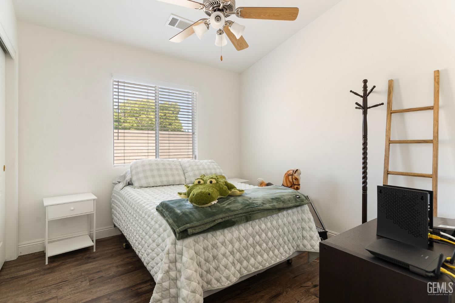 Undisclosed Address Bakersfield, CA 93311 - Photo 14 of 17 a bedroom with a bed and a window